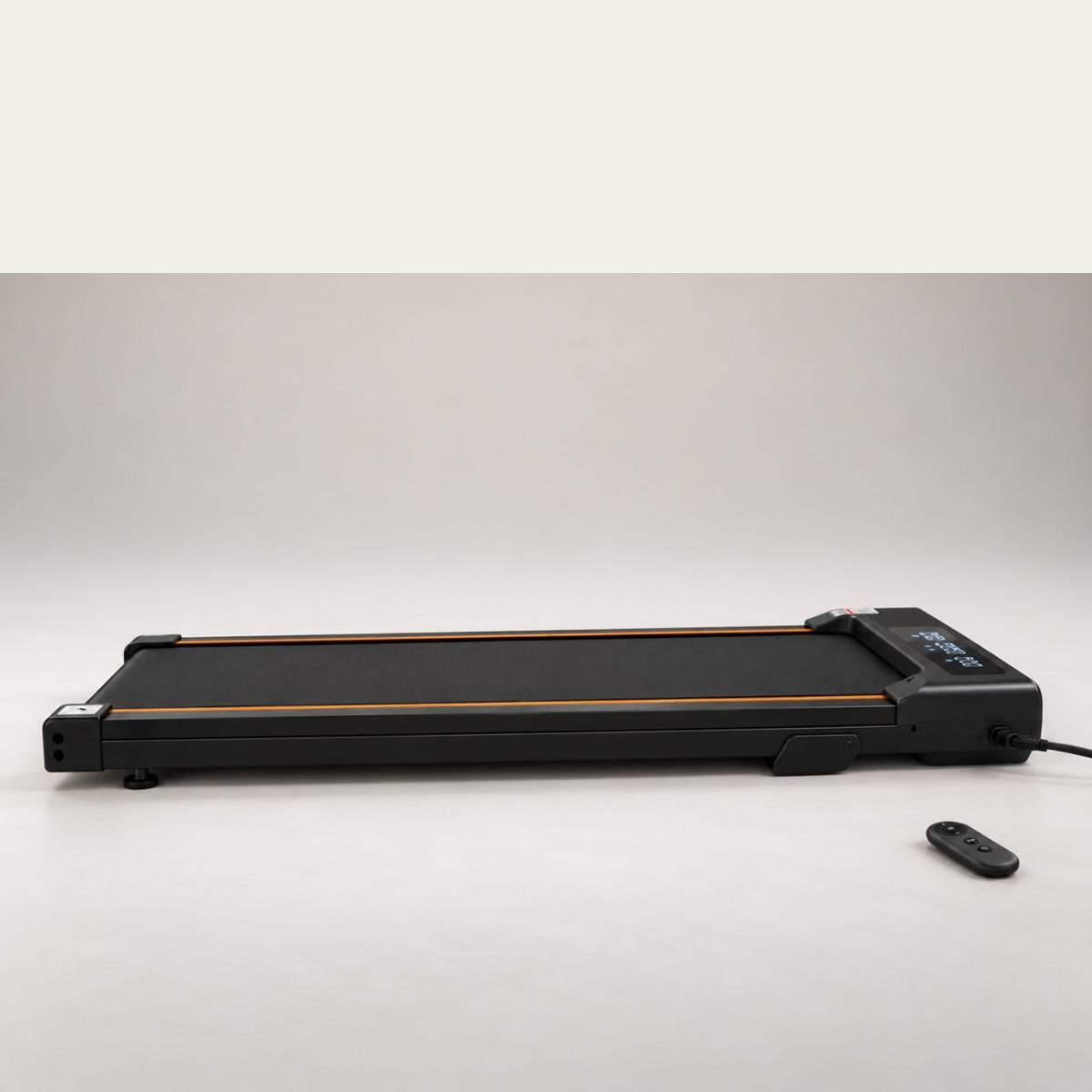 StepFlow walking pad in its flat low-profile format with remote